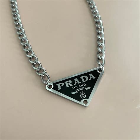 prada black triangle necklace|prada necklace triangle price.